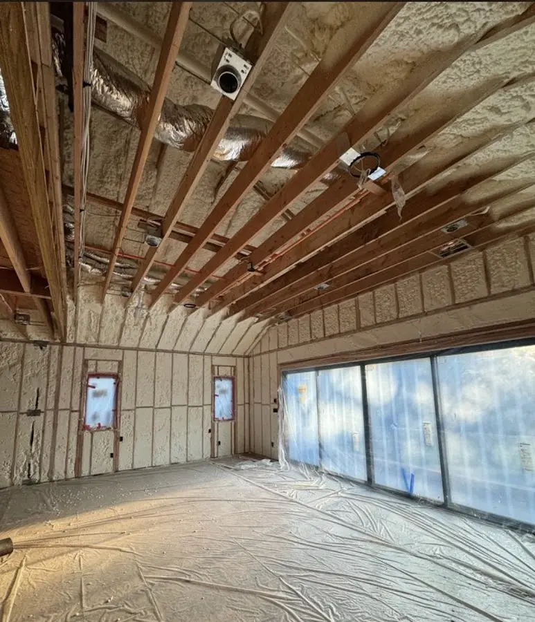 Interior walls and ceiling insulated with spray foam during new construction in Hamburg